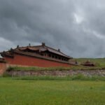 Erdene Zuu Monastery red wall and temple under storm sky Kharkhorin — Classic Mongolia Tour