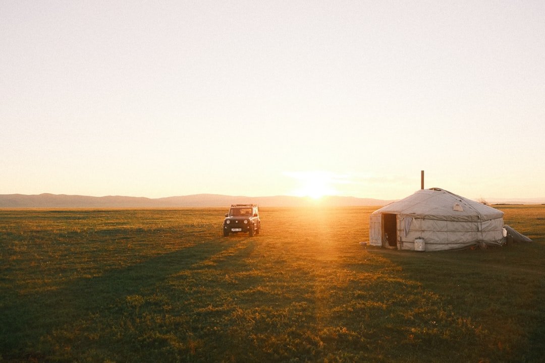 Mongolia steppe at golden hour with ger