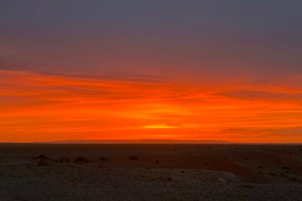 Gobi Desert fiery sunset orange red sky Mongolia