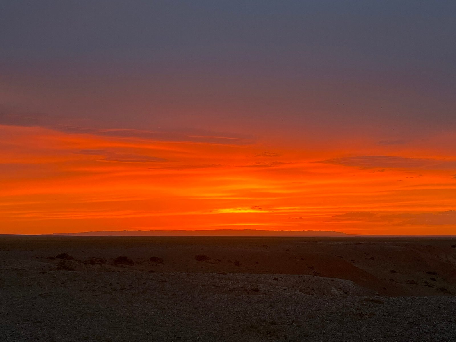 Gobi Desert fiery sunset orange red sky Mongolia