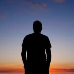 Man silhouetted at Khuvsgul Lake sunset northern Mongolia — Khuvsgul Lake Explorer Tour