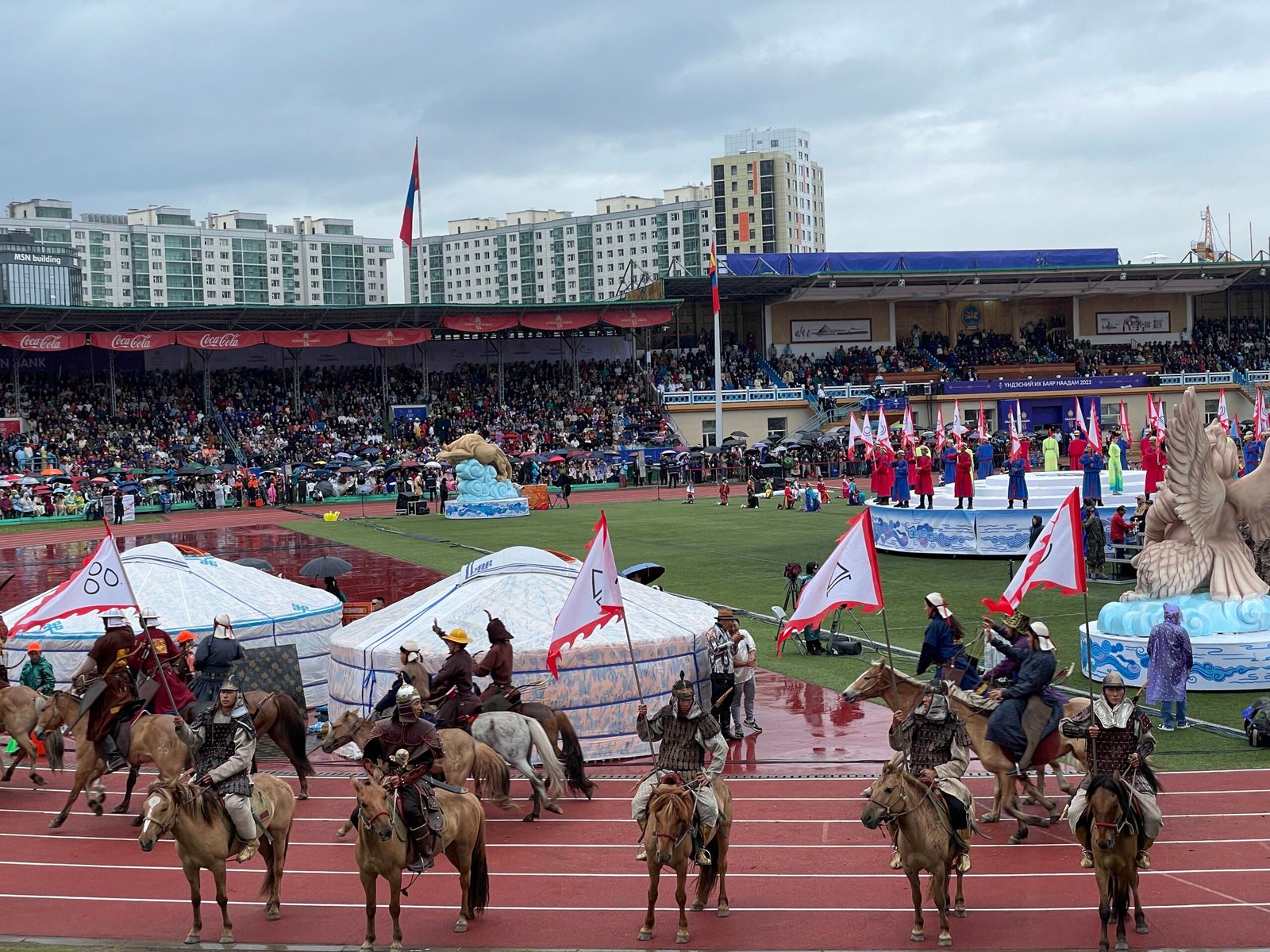 Naadam Festival opening ceremony horsemen galloping at National Stadium Ulaanbaatar Mongolia