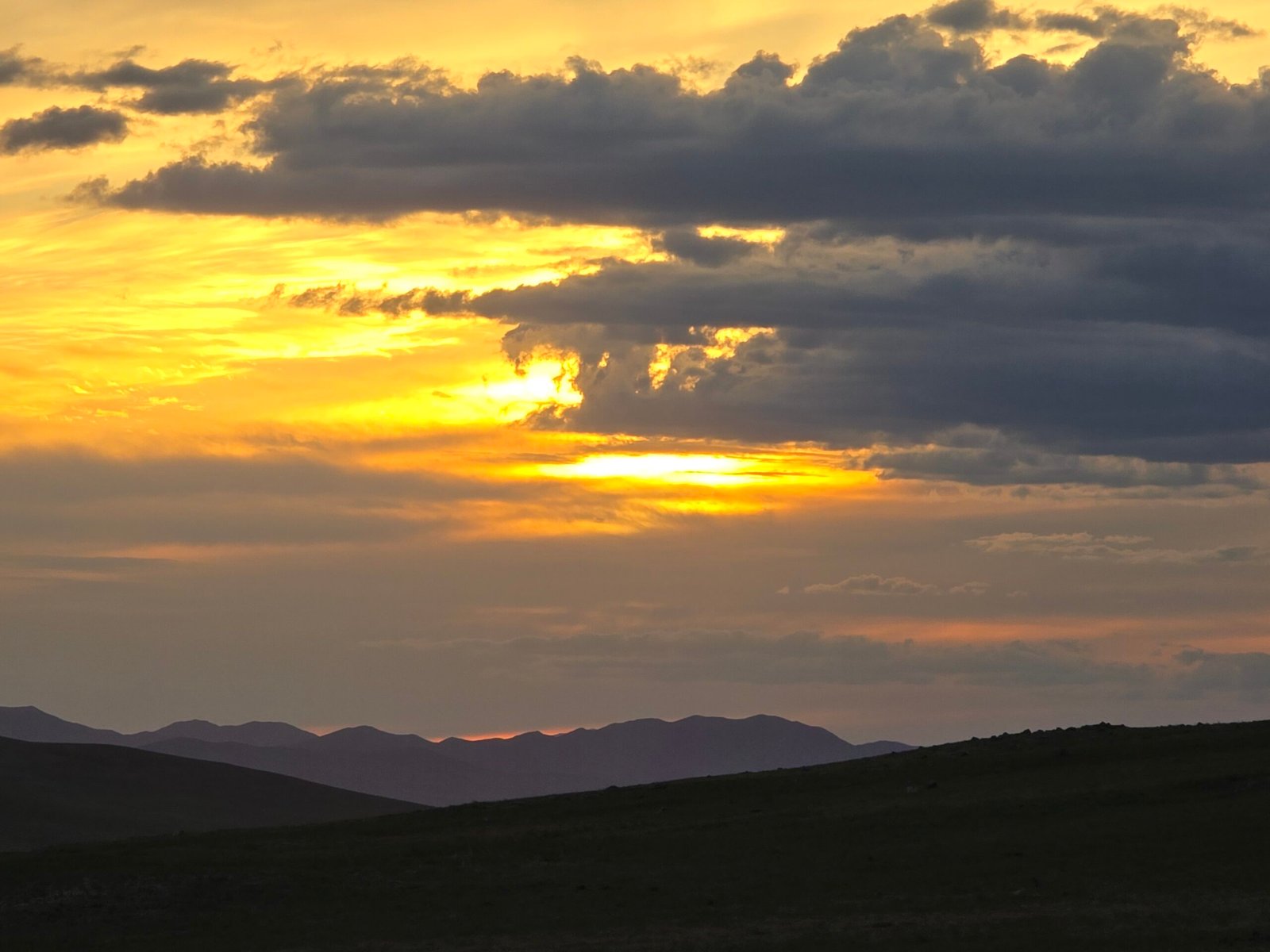 Golden sunset Mongolia steppe mountains