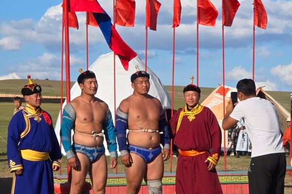 Naadam wrestlers competing in traditional bökh costume at Mongolia's national festival