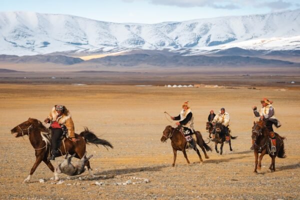 Kazakh eagle hunter with golden eagle at the Golden Eagle Festival in Bayan-Olgii Mongolia