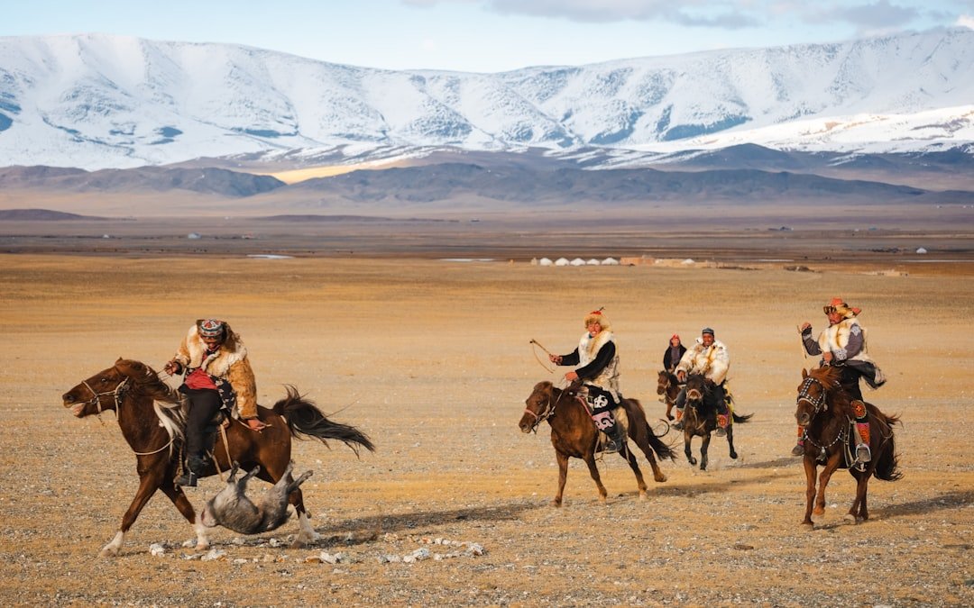 Kazakh eagle hunter with golden eagle at the Golden Eagle Festival in Bayan-Olgii Mongolia