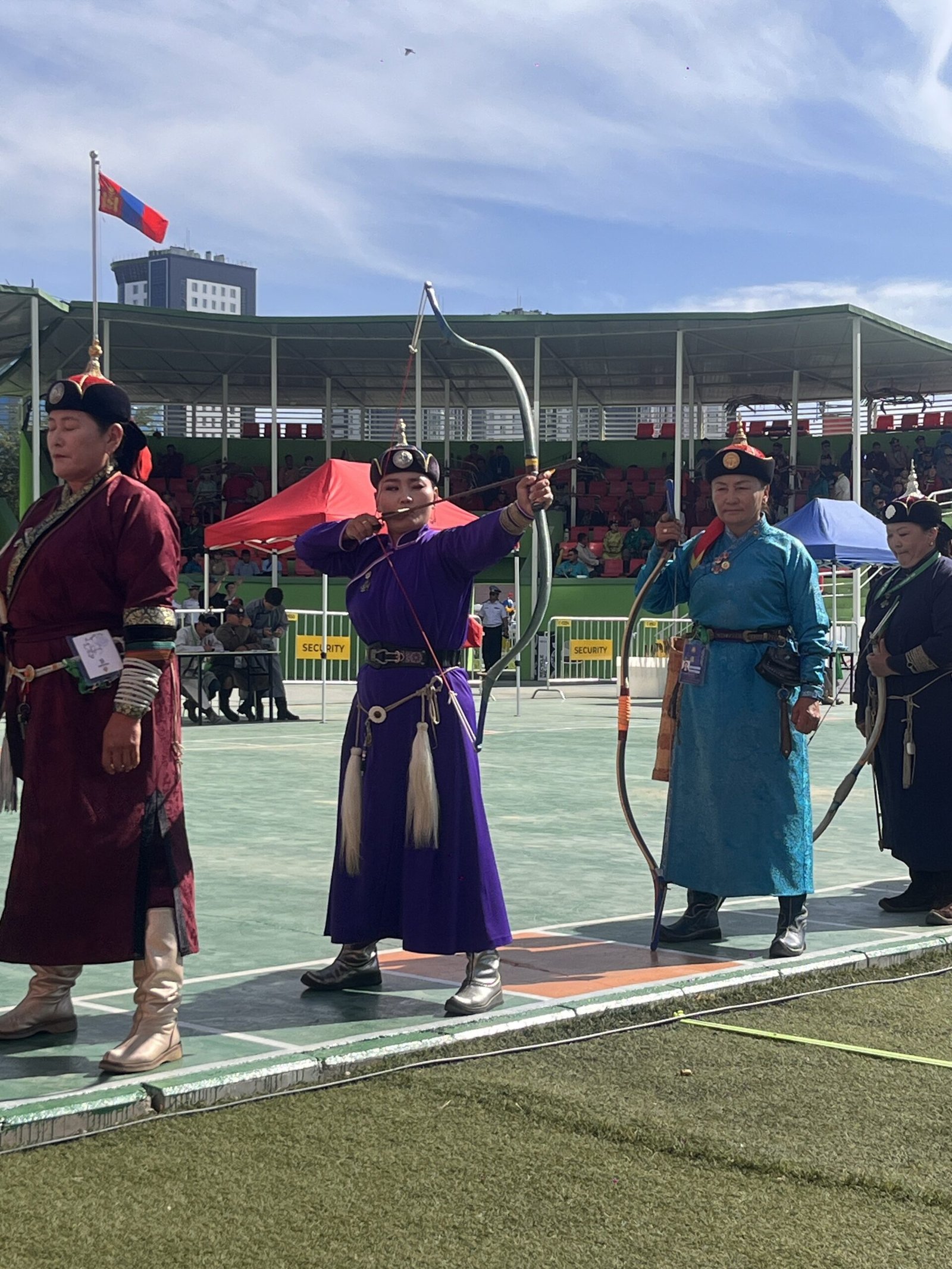 Mongolian archers in traditional costume at the Naadam stadium